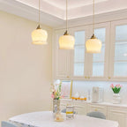 Suspension design BRIXO en laiton – luminaire design salon – Klaross