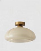 Plafonnier en verre jaune laitonné design, forme arrondie, idéal pour éclairage moderne du salon ou de la chambre.